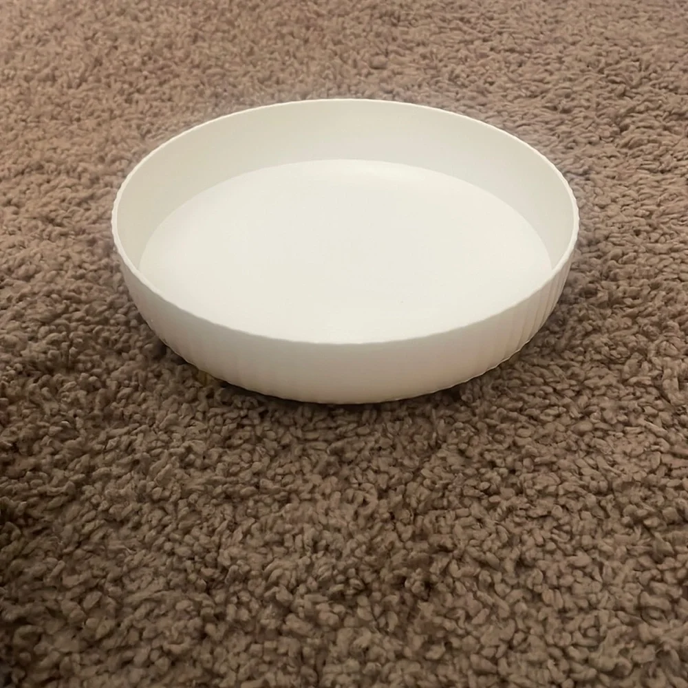 NWT small size Plastic rotating white circular container. Has feet. Rotates 360